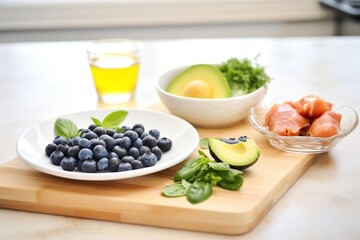 Fototapeta na wymiar keto diet foods: eggs, avocados, blueberries