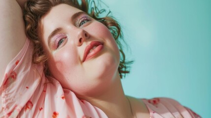 In a horizontal studio portrait, a plus-size lady embraces comfort and style in pastel pajamas against a soothing pastel background.
