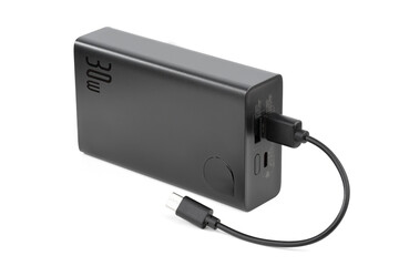 Power bank for charging mobile devices. White smart phone charger with power bank. battery bank. External battery for mobile devices.