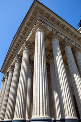 Naklejka premium Portico of the famous St. Isaac Cathedral on a summer day. View from below. Saint Petersburg. Russia