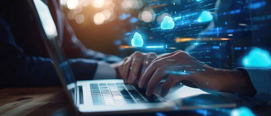 Businessman downloading computer files or installing software on a laptop computer, cloud storage technology, data backup, cyber security