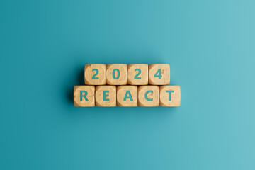 2024 react words on wooden blocks and white background