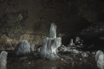 Enchanting Underground Ice Cave with Natural Icicles and Frozen Water