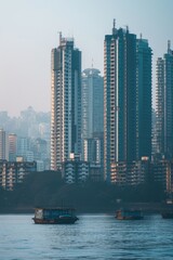 Fototapeta premium Two boats floating in the water with tall buildings in the background. Suitable for travel and urban cityscape themes
