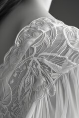 A black and white photo of a woman wearing a wedding dress. Ideal for wedding-themed projects and bridal inspiration
