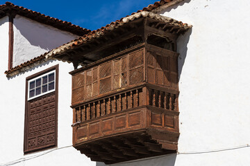 Historic gridded wooden balcony in San Juan de la Rambla, Tenerife, Spain