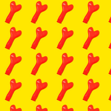 Inflated red balloons in light arranged in rows