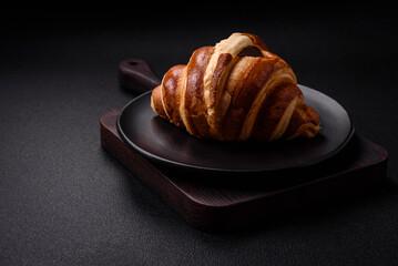Delicious crispy sweet croissant cornet with chocolate