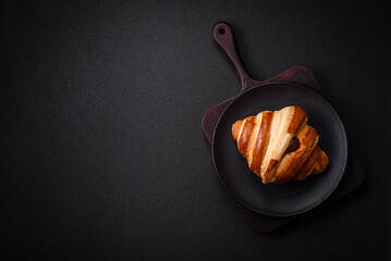 Delicious crispy sweet croissant cornet with chocolate - obrazy, fototapety, plakaty