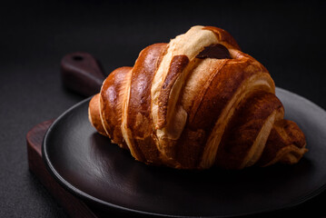 Delicious crispy sweet croissant cornet with chocolate