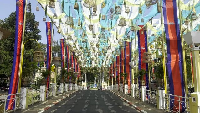 Decorations on a bridge. Road bridge with flags, bells, ribbons and decorative art. Siem Reap, Cambodia.