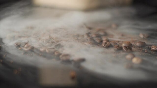 
Coffee beans surrounded by smoke, coffee roasting
