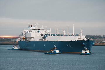 LNG Tanker Mooring In The International Trade Port. Gas Transportation Facility. Natural Gas...
