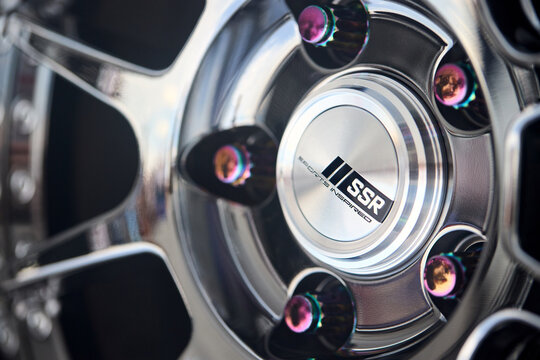 Berlin, Germany - August 20, 2022: SSR SP3 SBC Car's Rim detailing with SPORTS INSPIRED Center Cap selective focus shot with copyspace.