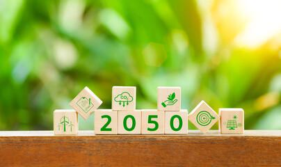 Reduce CO2 emissions concept. The 2050 year on wooden block. Carbon neutral, Net Zero, Climate...