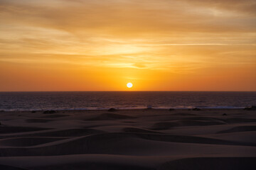 Fototapeta premium Asian Girl looking sunrise in Maspalomas. Spanish sunrise in Spain. Gran Canaria Sunrise and sunsets. 
