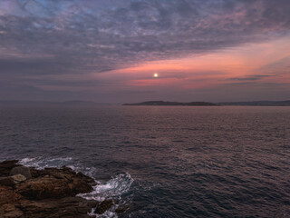 Twilight Serenade: Moonrise over Coastal Waters