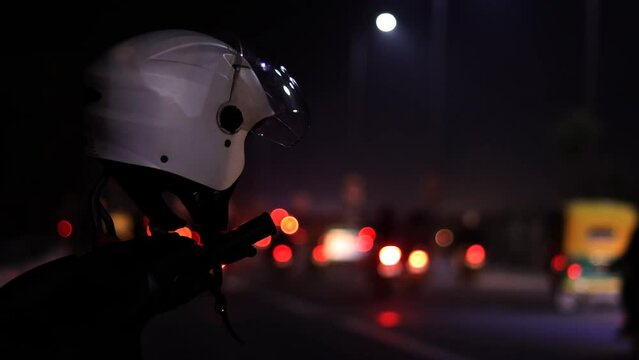Traffic time lapse in Delhi city video and scooter parked on roadside at night.
