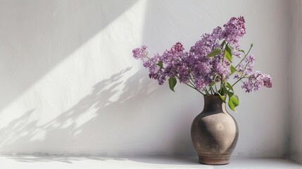 A Vase Filled With Purple Flowers Is Sitting On A Window Sill
