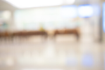 Bright blur background of modern hospital corridor interior with copy space