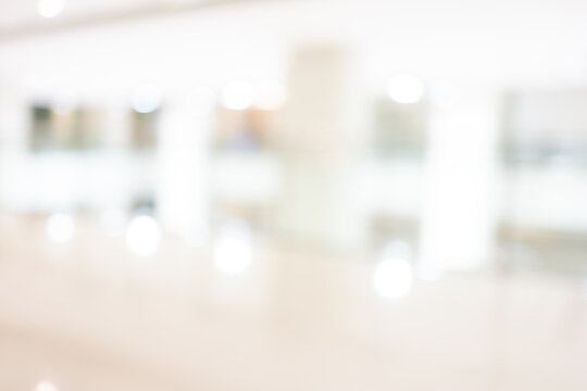 Bright blur background of modern hospital corridor interior with copy space