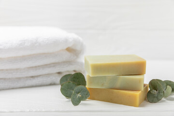 Soap on a texture background. Soap with eucalyptus extract and natural herbs on a white background....