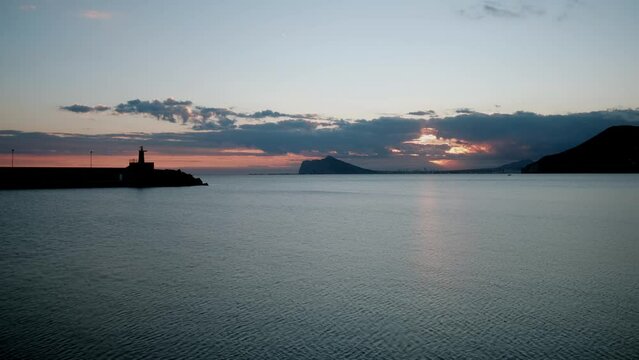 Time lapse video sunset over the Mediterranean Sea. Sunset on Costa Blanca. Calp, Alicante, Spain