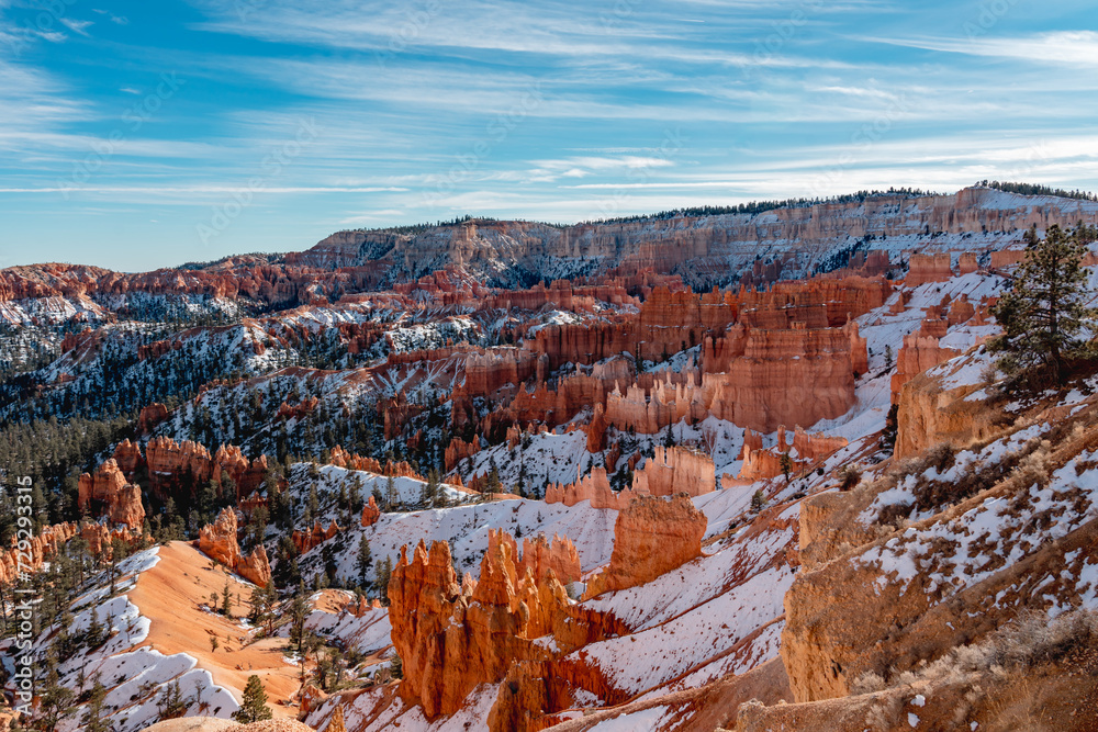 Wall mural bryce canyon national park in winter, unique rock formations in utah covered in snow, orange rocks i