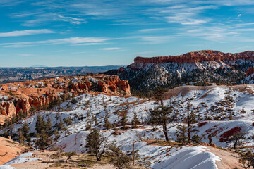 Bryce canyon national park in winter, unique rock formations in utah covered in snow, orange rocks in snow, cold winter in the usa