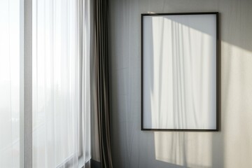 vertical frame on a wall next to a window with sheer curtains