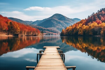 Autumn lake view with wooden dock and colorful trees - obrazy, fototapety, plakaty