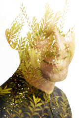 A portrait of a smiling man in double exposure disappearing into the background - 729301599