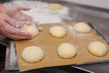 The chef prepares the dough for tortillas and burgers.