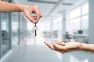 Officer gives keys from the house to client, real estate