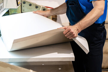 close up engineer hand finger press button controling cnc machine, Workers operating factory machinery in warehouse