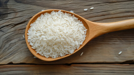 Fototapeta na wymiar Rice pile in wooden spoon isolated on wood table background.