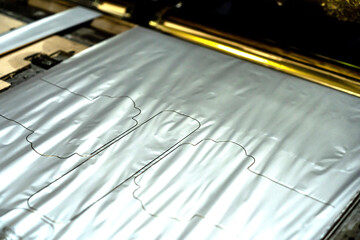 Offset printing machine feeder transfer metallic paper through the feeding table to the printing...