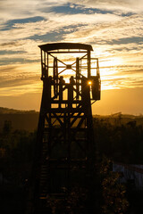 Detail of the mining tower or winch in the old mining facilities of Peña del Hierro near the source of the Río Tinto in Huelva at sunset
