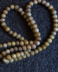 Rosary beads on dark background