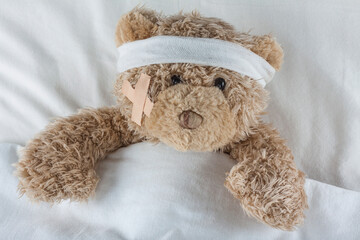 Injured Teddy Bear wrapped in bandages