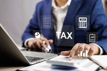 Tax and Vat concept. Government, state taxes concept. Businesman using tablet and laptop to complete Individual income tax return form online for tax payment. Data analysis, financial research. - obrazy, fototapety, plakaty