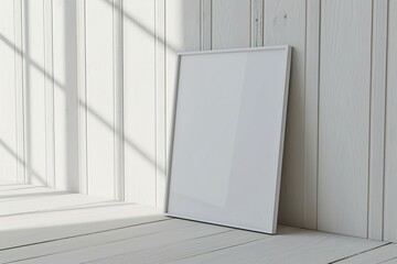 thin a3 sized frame mockup leaning against a white wooden wall, reflections of windows, tilted side view