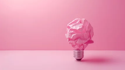 Deurstickers Crumpled paper light bulb on pastel pink background. Pink ECO energy idea concept. Copy space.  © Femmes.Digital