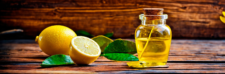 Obraz na płótnie Canvas lemon essential oil in bottles. Selective focus.