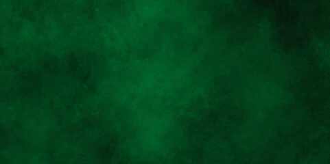 Fototapeta na wymiar Abstract texture of emerald green color,Throwing green powder out of hand against black background.with space for texter,Dark cracked cement and smoked poster.