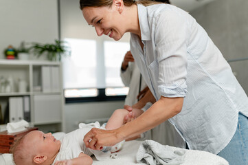 Appointment with a consultant pediatrician. Mother and baby at pediatrician's office.