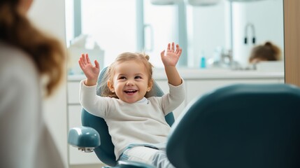 At the doctor's appointment. A candid emotional photo of a child sitting in a dental chair, holding a toy rabbit and cheerfully giving a high-five to the nurse - obrazy, fototapety, plakaty