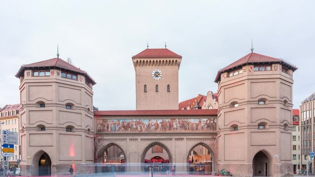 The Isartor at the Isartorplatz in Munich timelapse. One of four main gates of the medieval city wall. The gate is located close to the Isar and was named after the river. Traffic on a street. Germany