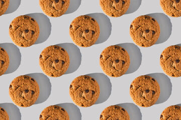 Oatmeal cookie pattern with sharp shadow on gray background