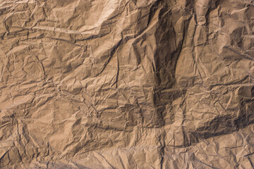 Crumpled craft tissue paper sheet. Texture. Background.